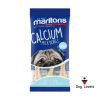 A blue pack of Mailtons Calcium Bones 50g for small dogs displays a pug and bone-shaped treats, highlighting calcium-rich content that supports dental health.
